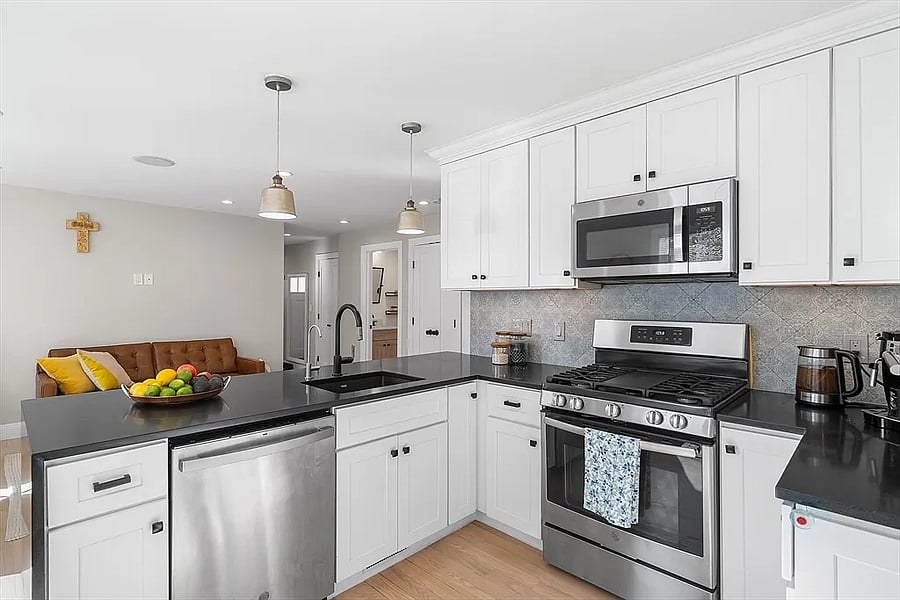 Open floor plan. Kitchen/Living Room. Shaker cabinets. New appliances. Honed marble countertops. Modern Danish-style design throughout. Immaculately clean.