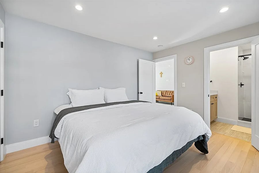 Primary BR features two closets with built-in custom storage. It also features an en suite bathroom.
