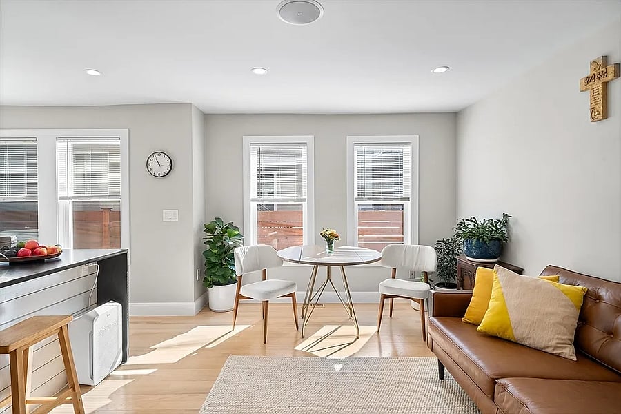 Light-filled living space perfect for entertaining or for serene respite. The table pictured has been replaced. The current table is an oval wooden model from Room and Board to allow for 4-6 person dining.