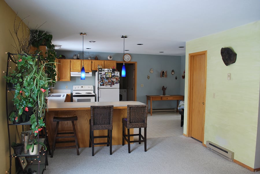View from the 1st Living room. Open floor plan into the kitchen and half bath.