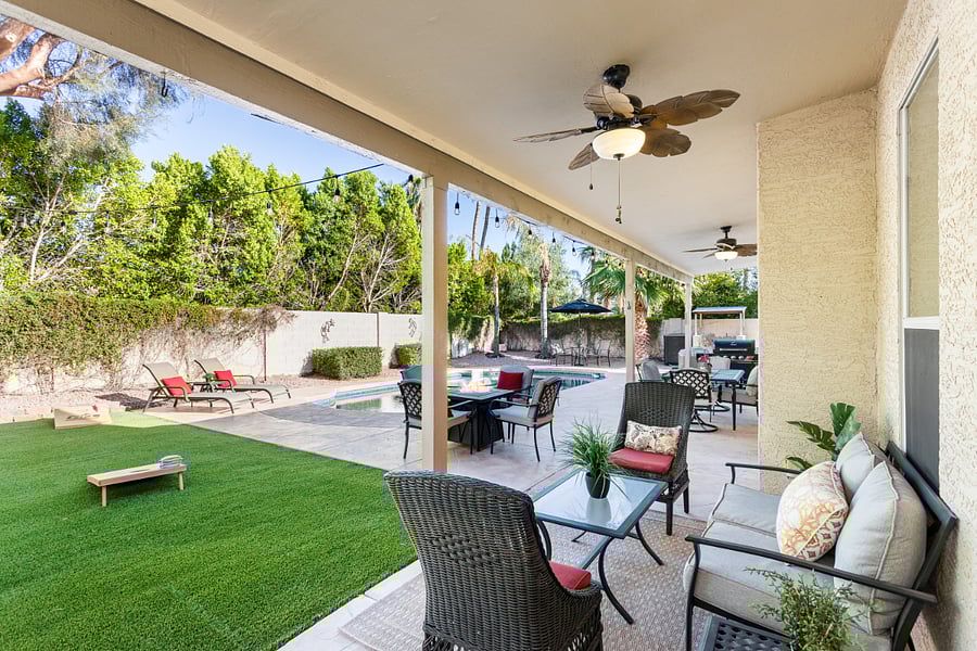 Large covered patio with night lighting and fans