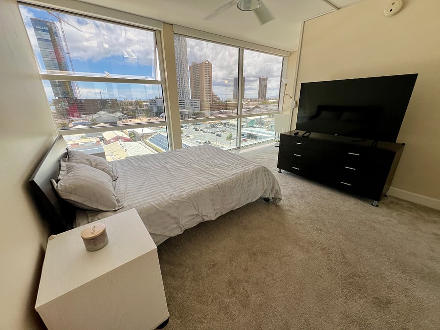 Large primary bedroom with 55" TV