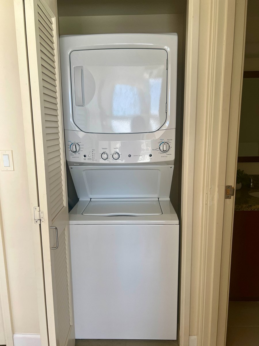 Stacked washer and dryer in unit