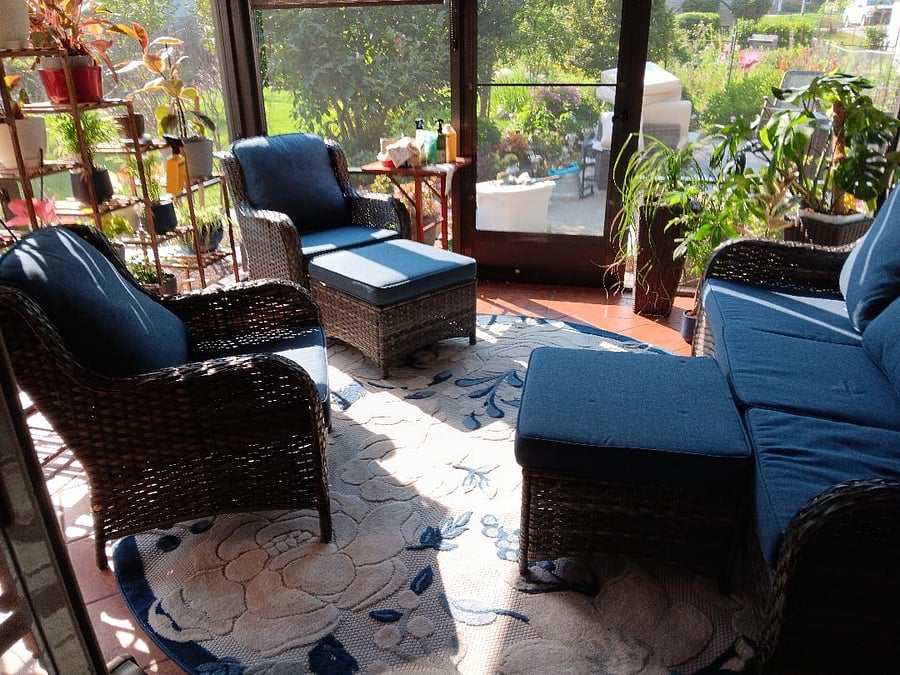 Screened back porch adjacent to furnished patio and grill and beautiful gardens. TV out there, but a nice place to sit and relax - read, watch TV, take a nap.