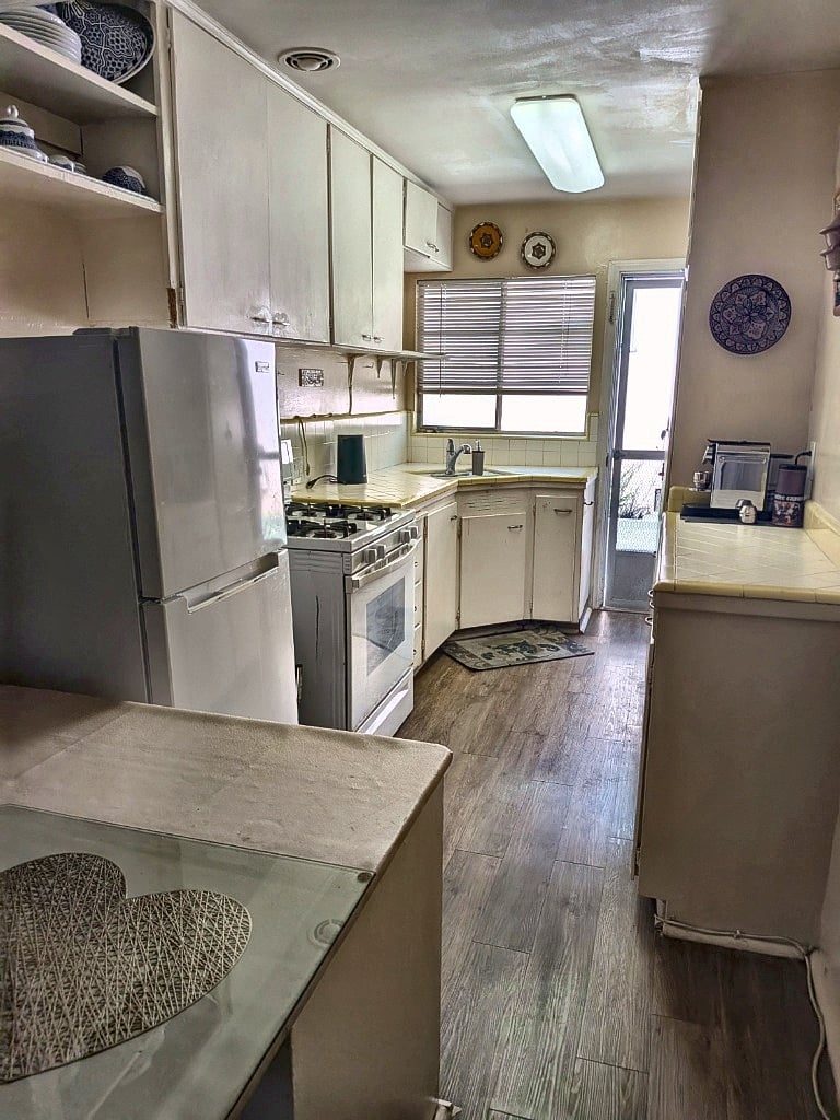 Fully Equipped Turnkey Kitchen: Complete with a gas range, full refrigerator, custom cabinetry, a Nespresso machine, and an Air Fryer for easy meals.