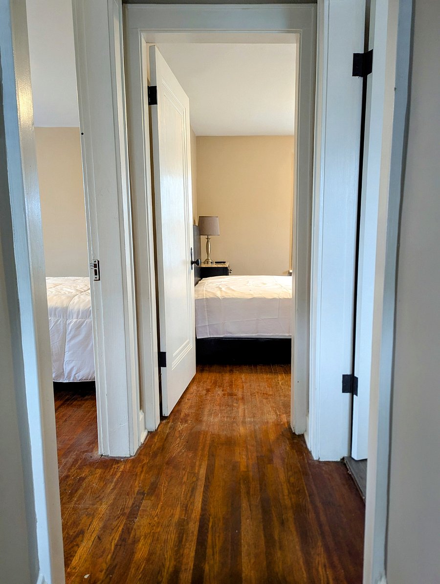 View from top of stairs. Bedrooms straight ahead and to the left. Bathroom to the right