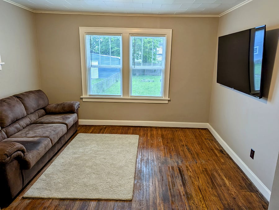 Cozy living room with 65-in Smart TV