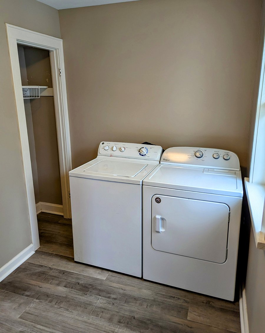 Washer and dryer in pantry area behind kitchen