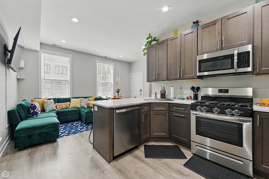 The heart of the home-an open-concept kitchen and living space designed for comfort and community. With modern appliances, a 5-burner gas stove, and a complete set of cookware, everything you need to cook, connect, and unwind is right at your fingertips.