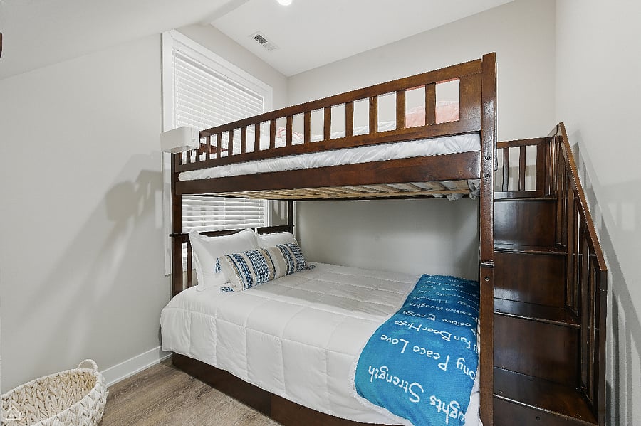 Comfortable full-size bunk beds with built-in stairs and underneath storage. 