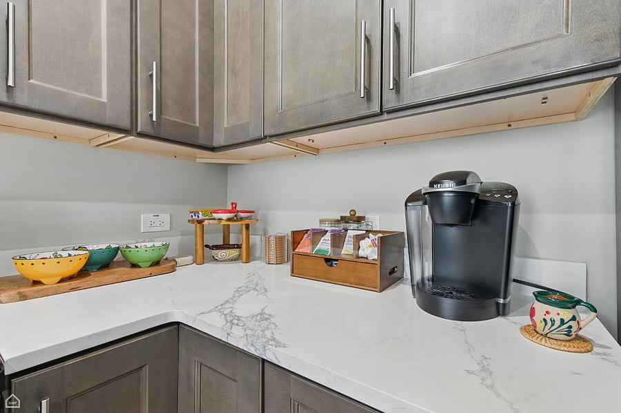 Start your day at our cozy coffee nook. A Keurig, tea station, colorful ceramics, and your favorite mug are all waiting for you.