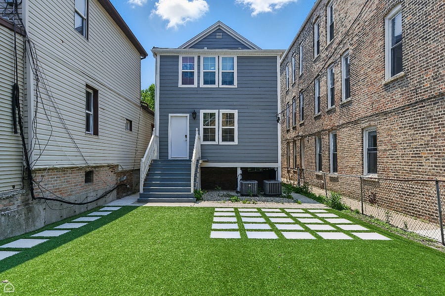 Tucked behind the home, this stunning backyard space is simple, sunny, and ready for fresh air relaxation. 