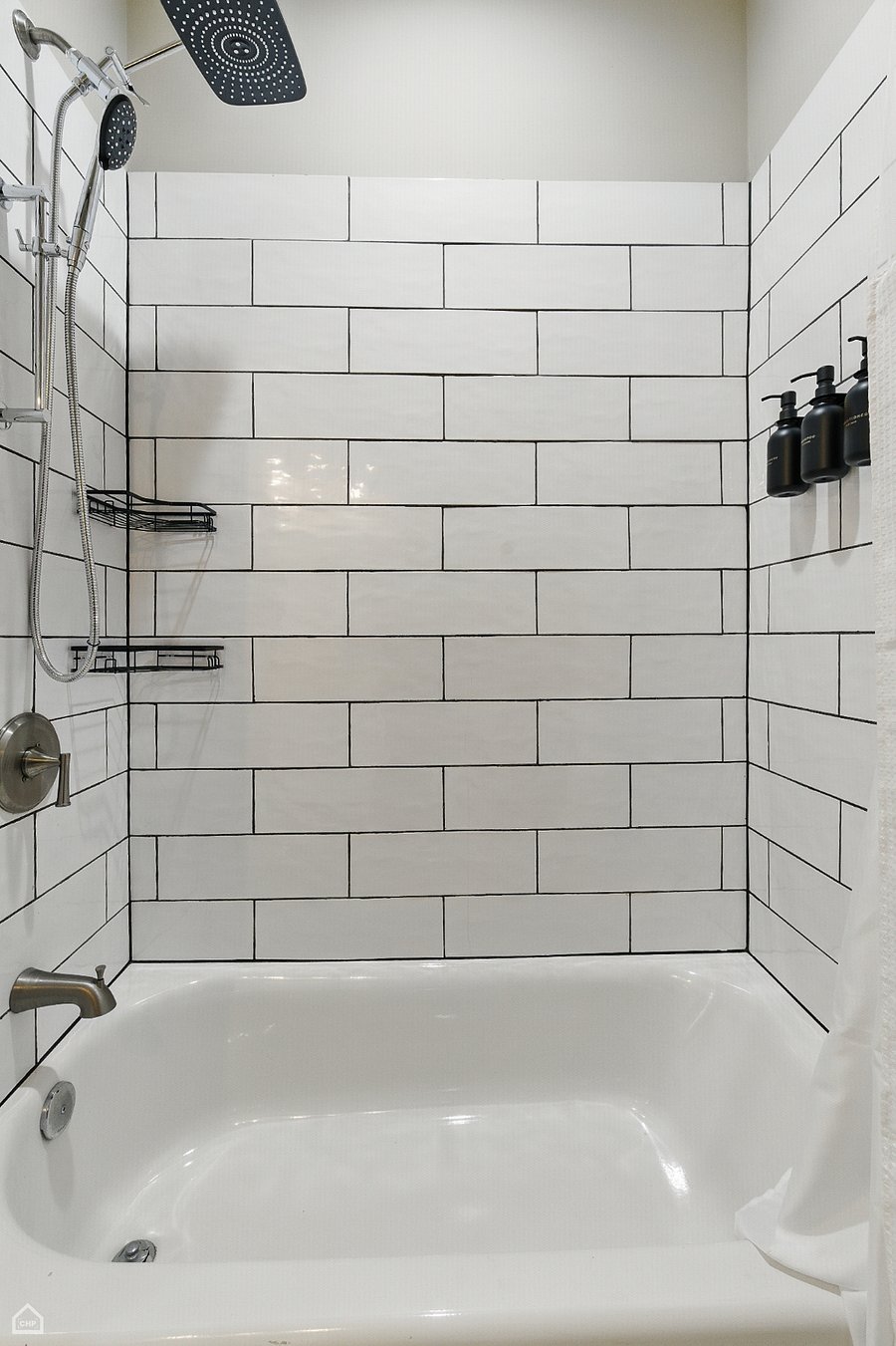 Wash the day away with a hot shower under the rainfall showerhead. The deep soaking tub and full tile surround create a clean, calming space to reset, rinse, and refresh.