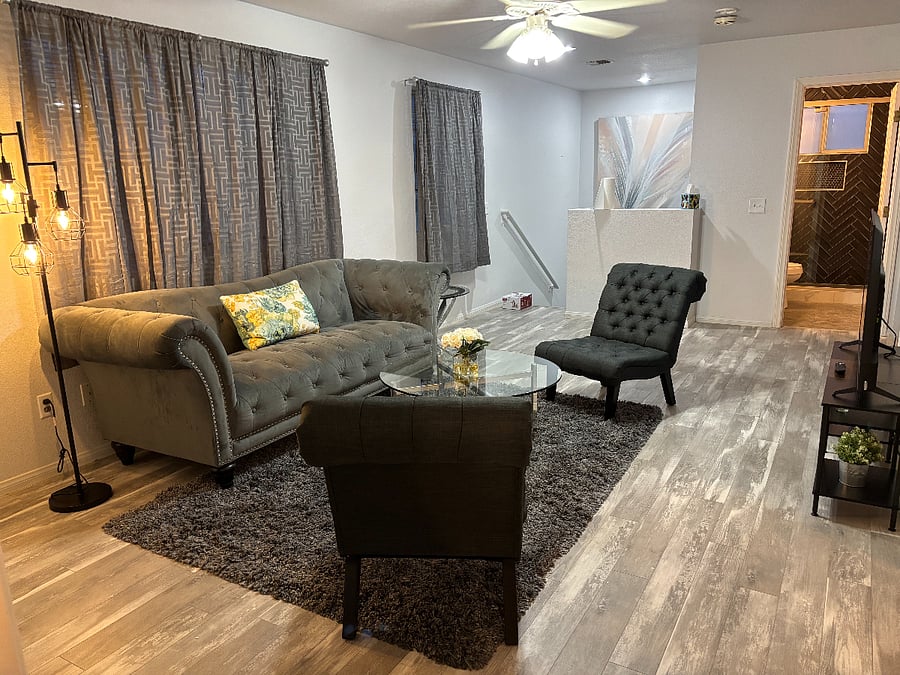 Living Room looking towards bathroom and entrance stairs