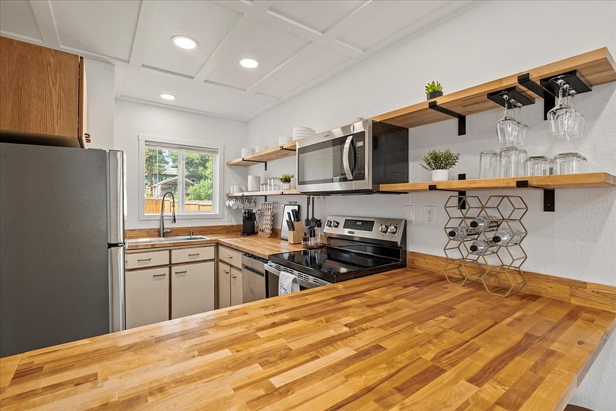 Kitchen with Center Island and Butcher Block Countertop