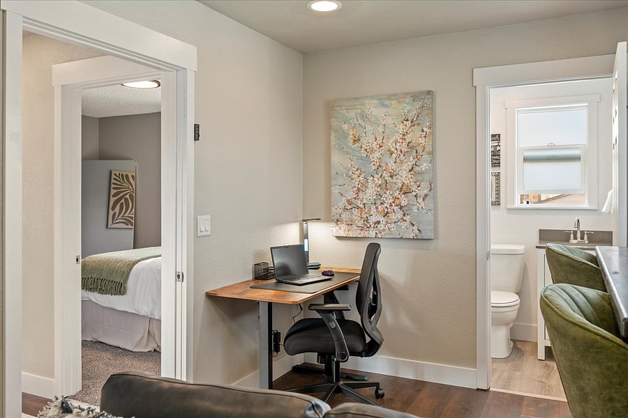 Family room upstairs with a dedicated working space equipped with a standing desk