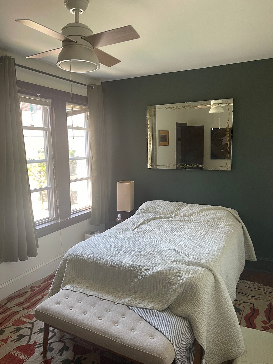 Primary bedroom. Has small closet, 2 small comfy benches for sitting, full sized brand new Saatva mattress