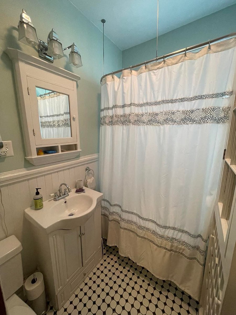 Victorian style bathroom with clawfoot tub and shower