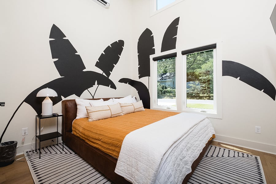 20 foot ceilings, natural light and mural in bedroom