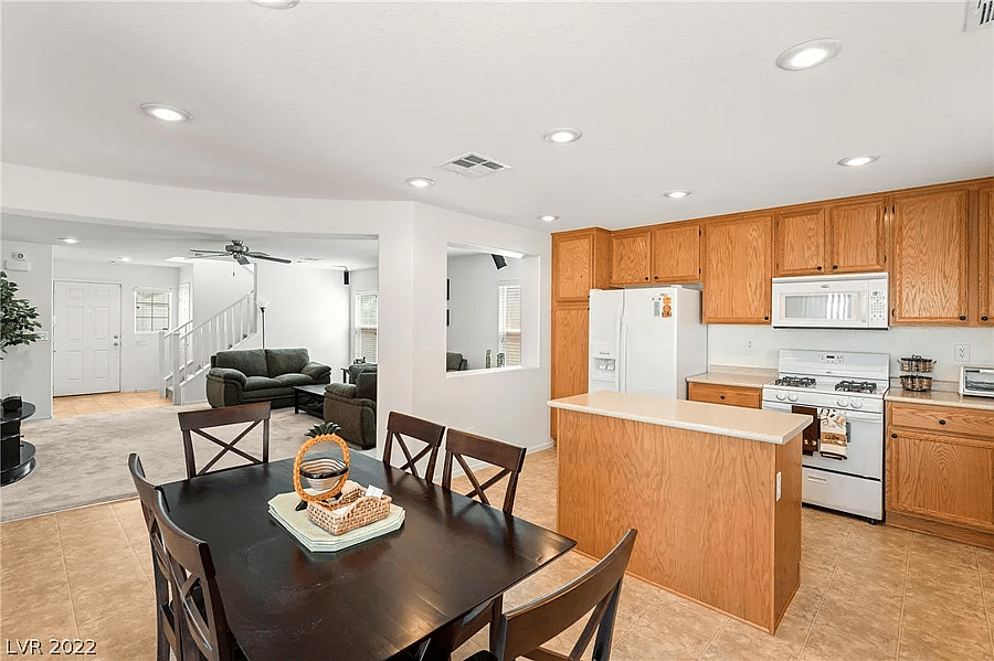 Wide shot of the kitchen, fully stocked with cooking supplies (ingredients and pots/pans).