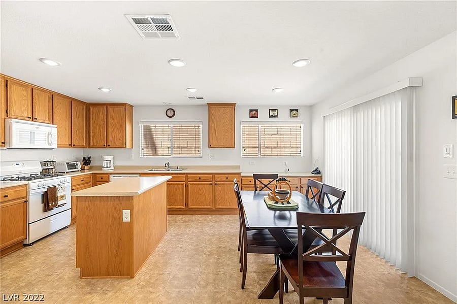 Wide shot of the kitchen, fully stocked with cooking supplies (ingredients and pots/pans).