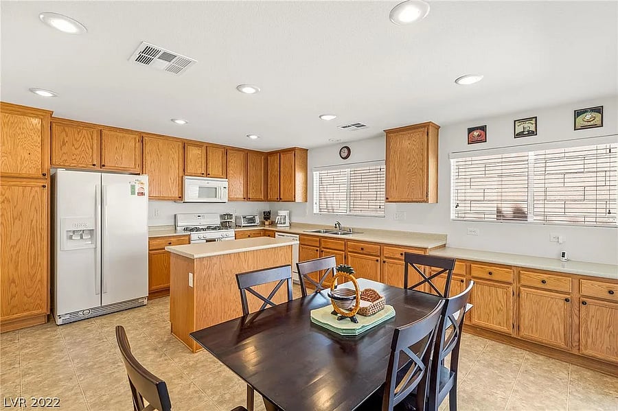 Wide shot of the kitchen, fully stocked with cooking supplies (ingredients and pots/pans).
