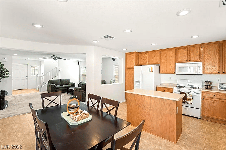 Wide shot of the kitchen, fully stocked with cooking supplies (ingredients and pots/pans).