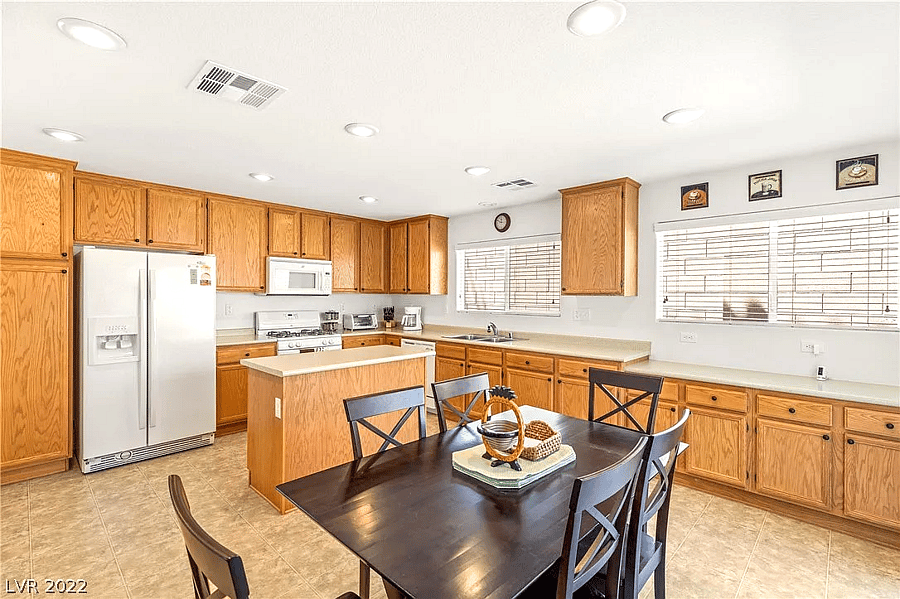 Wide shot of the kitchen, fully stocked with cooking supplies (ingredients and pots/pans).
