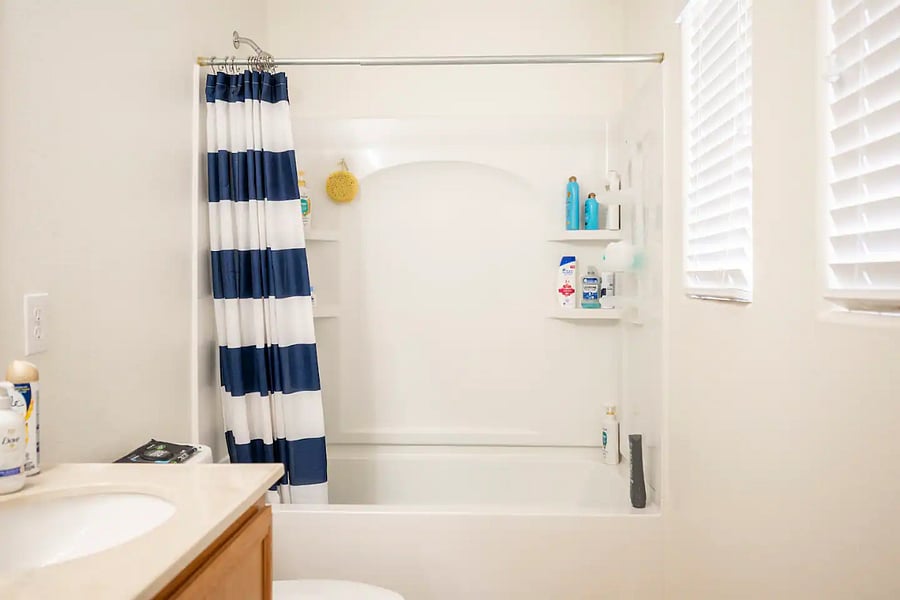 The dual-vanity guest bathroom, with complimentary shampoo, conditioner, and lotion.