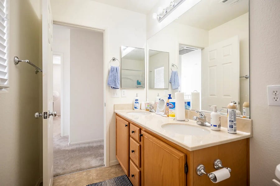 The dual-vanity guest bathroom, with complimentary shampoo, conditioner, and lotion.