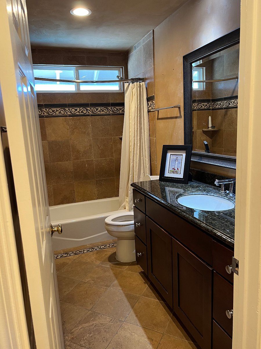 Hallway bath with tub and shower