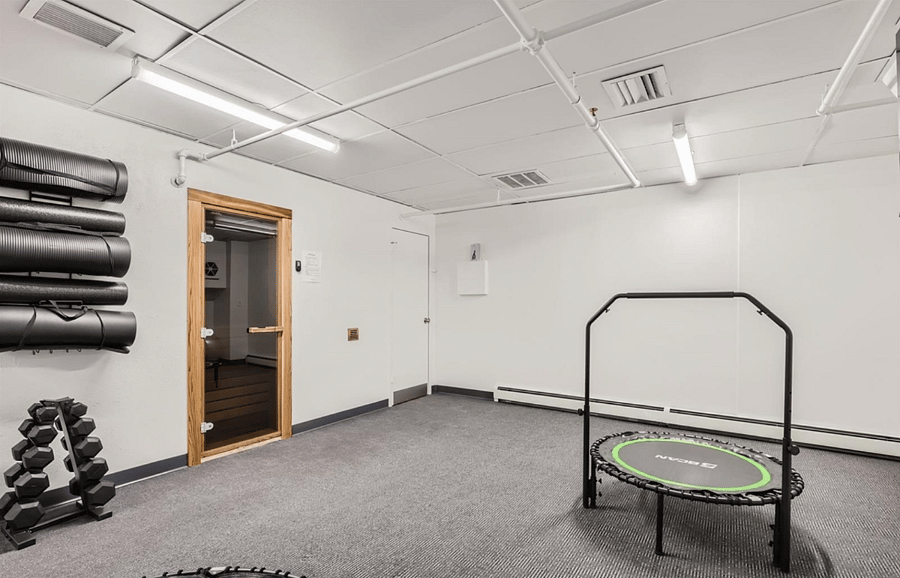 Sauna and the downstairs of the gym. Includes: steam shower, trampolines, 3 bathrooms, and a body-weight only workout area.