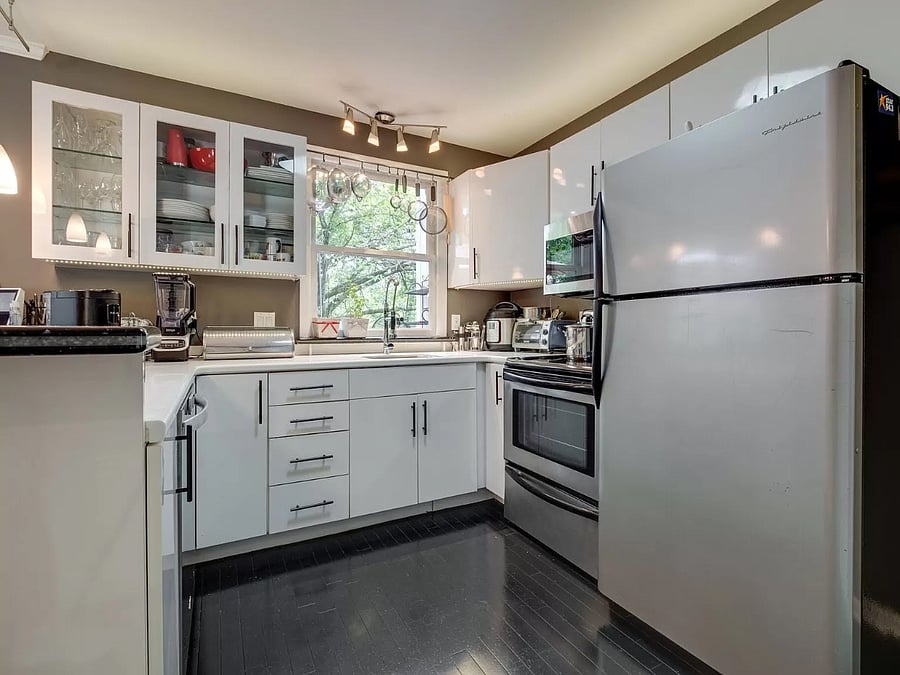 This kitchen, though not "large" has seen the preparation of thousands of family meals, including large Thanksgiving gatherings. Range, microwave, refrigerator/freezer with icemaker, disposal, new (2024) dishwasher, motion-activated kitchen faucet, bar seating for 4 people.