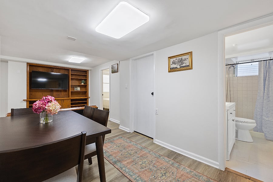 Image 4 (Updated Caption):
 Thoughtfully laid out dining area, perfect for meals, laptop work, or relaxing with a cup of coffee  conveniently located between bedrooms and bath.