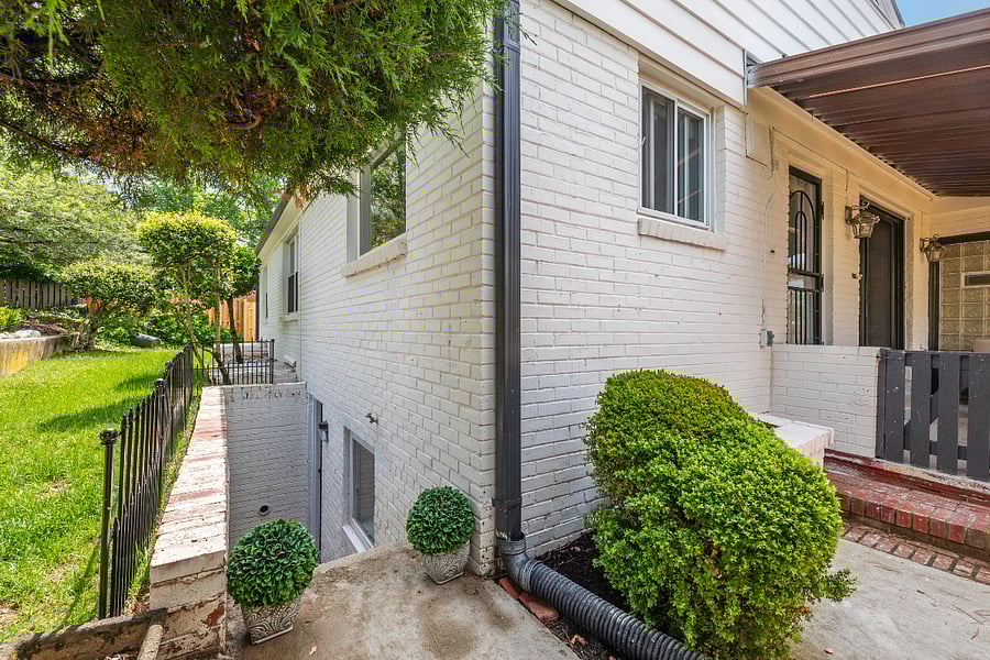 (Side exterior with private entrance):
 Private entrance to your lower-level apartment  enjoy total independence with all utilities included.