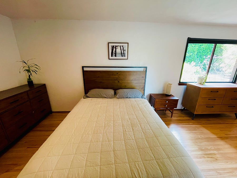 Queen size bed in master bedroom.