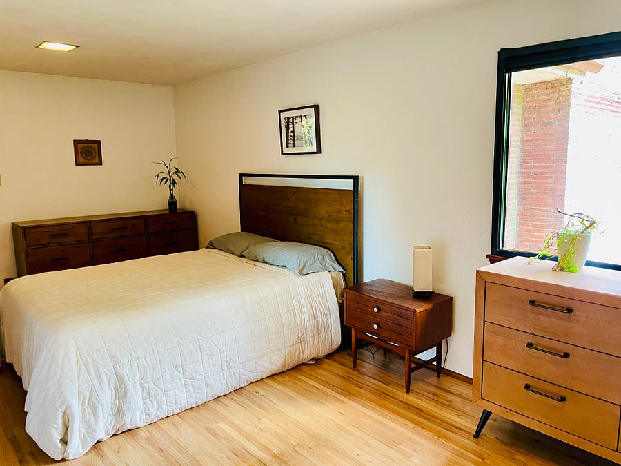 Master Bedroom looking back at the bed from the TV