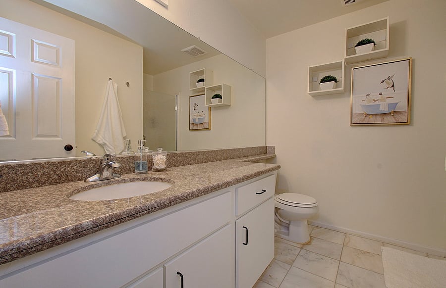 En-suite bath with rain shower