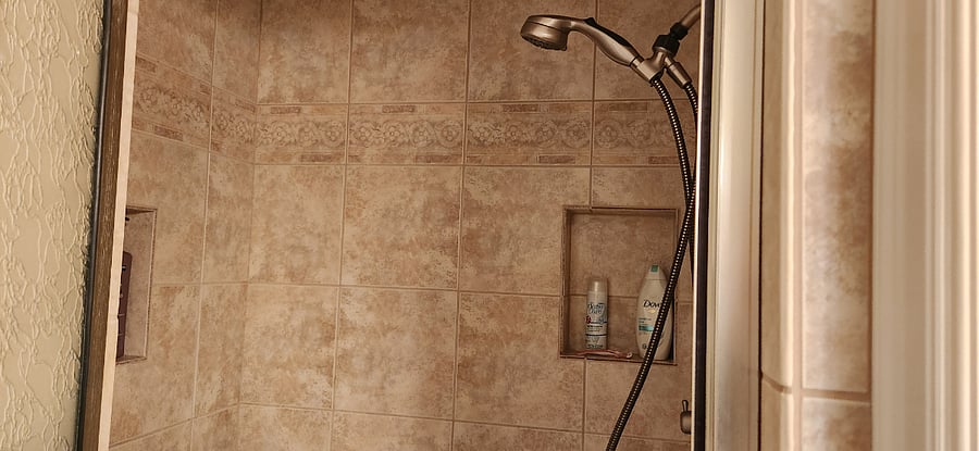 Shower is large with portable seat that can be removed if requested. Shower head and body sprays are adjustable with 3 build in shelves for shower product. Shampoo, conditioner, and body wash starter kit comes included in your rental. As well as a hairdryer and cleaning products.