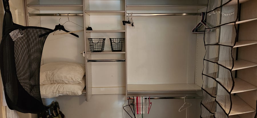 Both bedrooms include large modular closet space with adjustable shelving and hanging options. 