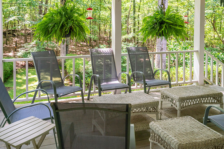 Peaceful back porch to unwind and relax. Humming birds love the 5 feeders!