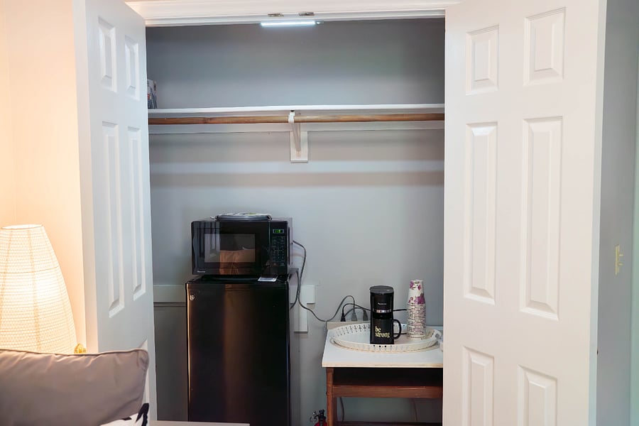 Mini fridge, microwave and coffee/tea pod maker In your sitting room closet.
