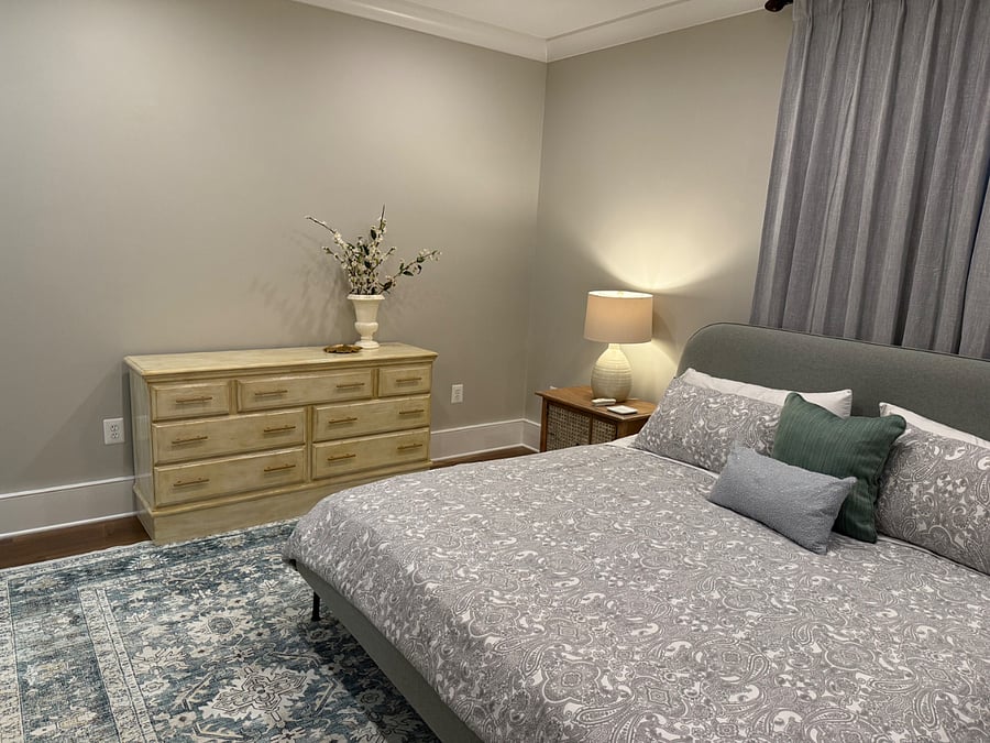 King size bed in expansive bedroom.