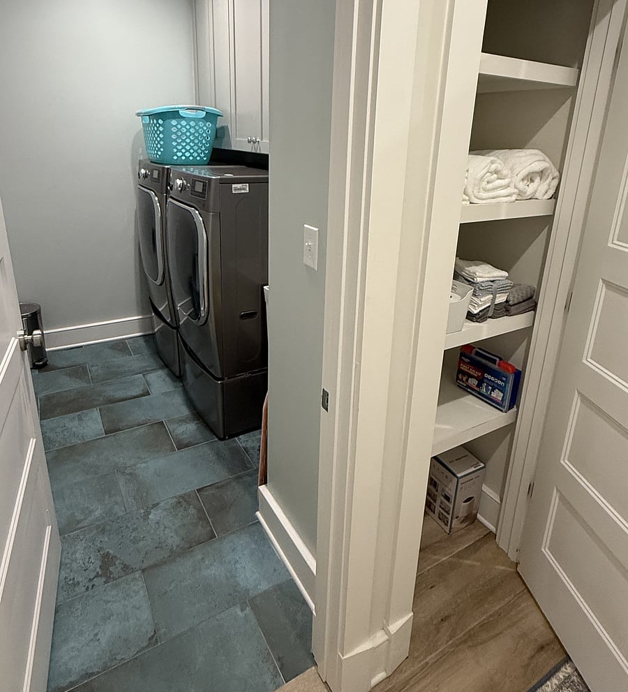 Lower level laundry room and linen closet.