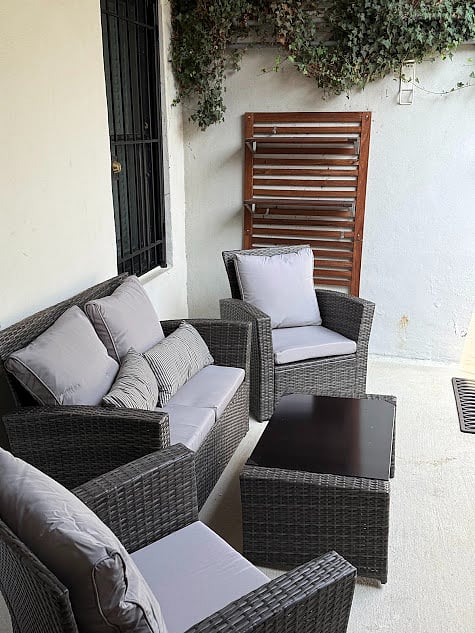 Front covered patio with outdoor furniture.
