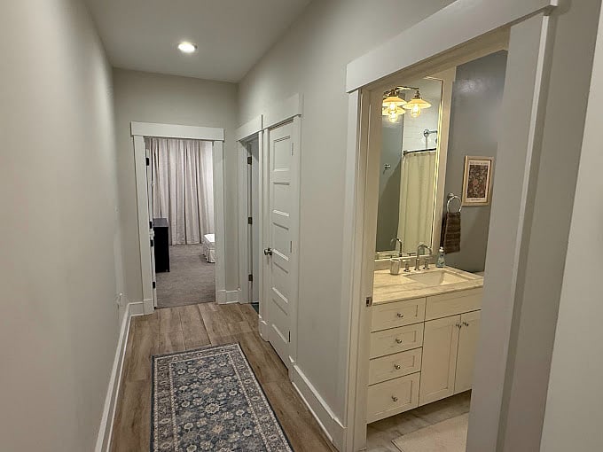 Continuing down hallway to bathroom and 2nd bedroom.