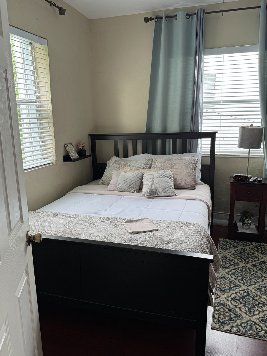 Bedroom #2 - Queen size bed, night stand, lamp, alarm/clock.