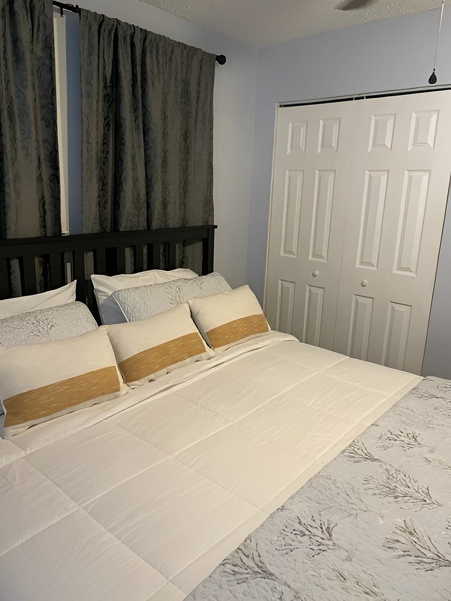 Main bedroom: King size bed, extra blankets and pillows in closet.