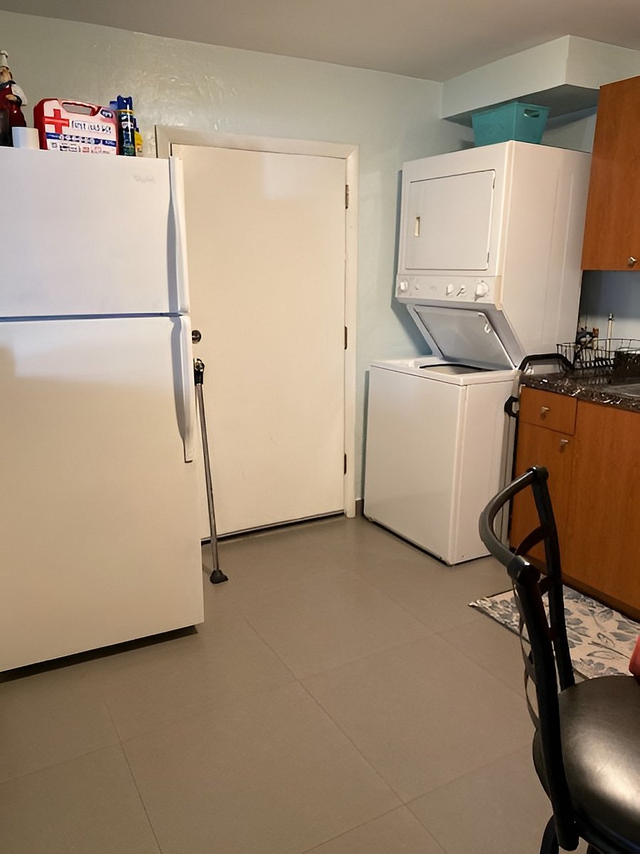 Kitchen: Refrigerator, washer-dryer, kitchen door to outside patio.