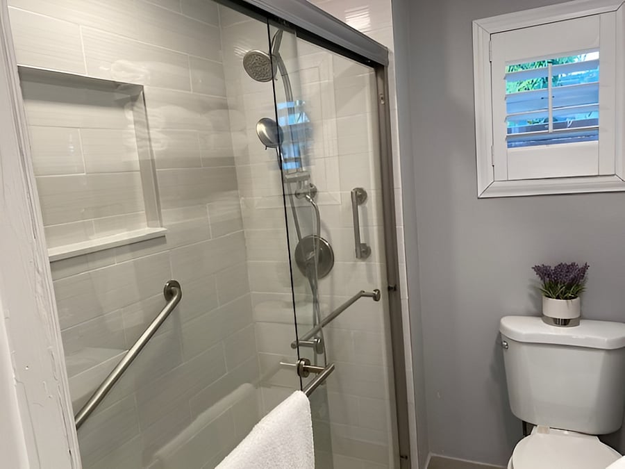 Bathroom: Step-in shower with both shower head and hand held shower wand. Multiple support bars.